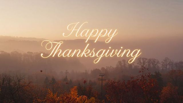 Glowing Cursive Happy Thanksgiving over Misty Autumn Valley during Golden Hour Sunrise