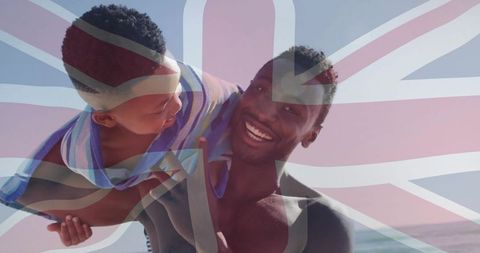 Happy Father and Son Beach Fun with Union Jack Background