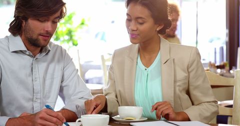 Colleagues Discussing Business Deal Over Coffee - Download Free Stock Images Pikwizard.com
