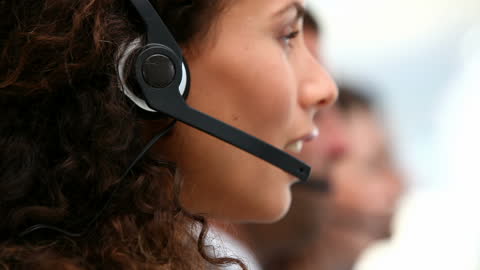 Confident Customer Service Representative Using Headset