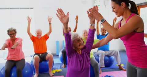 Senior People in Fitness Class with Instructor Encouragement - Download Free Stock Images Pikwizard.com