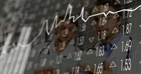 Doctors Reviewing Tablet with Stock Market Overlay