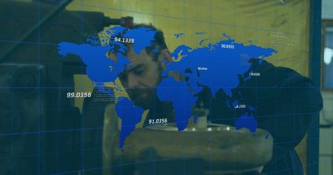 Machinist adjusting metal workpiece at vise with digital world-map hud and grid overlay