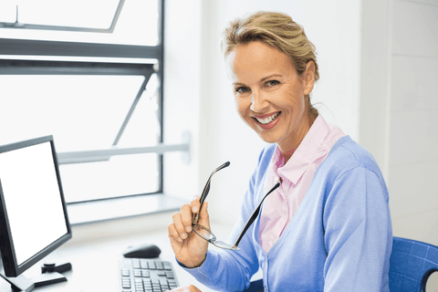 smiling businesswoman holding eyeglasses by transparent office window - Download Free Stock Videos Pikwizard.com