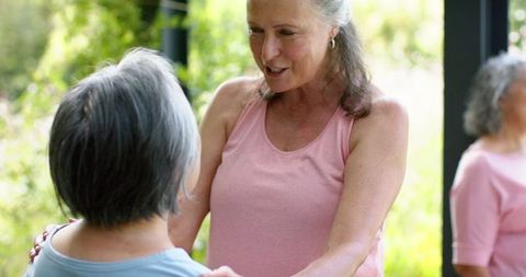 Senior Women Bonding Outdoors with Laughter and Warmth
