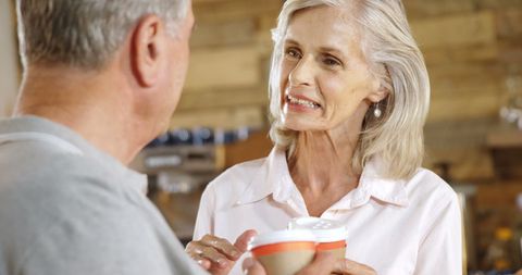 Senior Couple Enjoying Coffee in Cozy Cafe Atmosphere