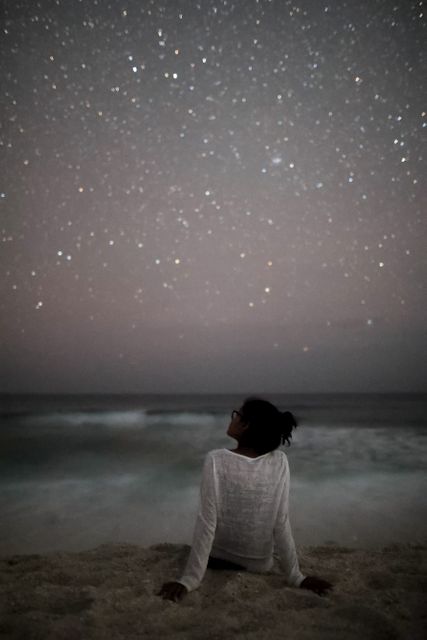Person Gazing at Starry Night Sky on Beach - Download Free Stock Photos Pikwizard.com