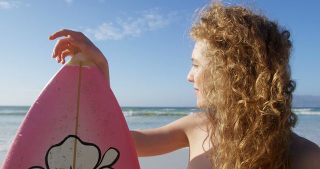 Young Woman Holding Surfboard at Beach - Download Free Stock Images Pikwizard.com