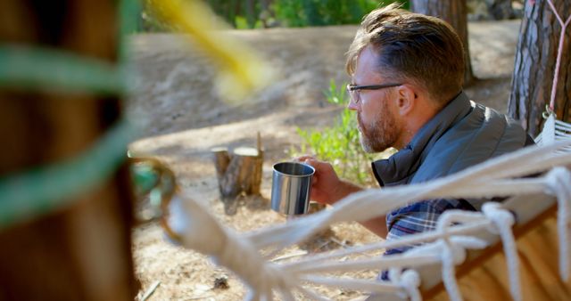 Man Relaxing in Hammock and Enjoying Nature with Cup of Coffee - Download Free Stock Images Pikwizard.com