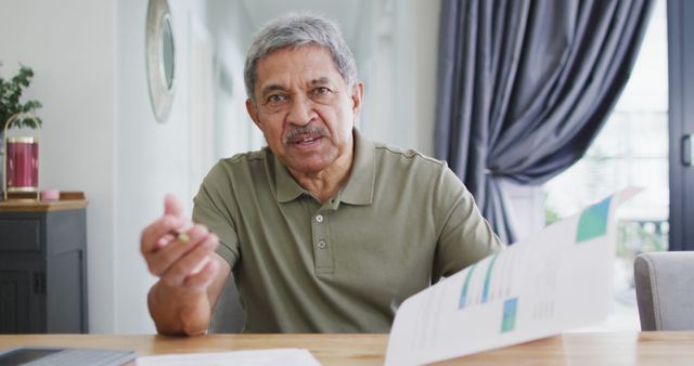 Senior Man Analyzing Financial Reports at Home Office - Download Free Stock Images Pikwizard.com