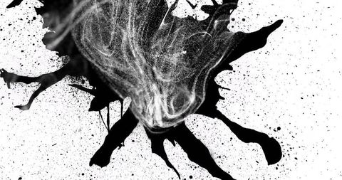 Abstract ink splatter with dynamic swirling textures