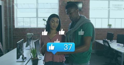 Colleagues Reviewing Tablet with Social Media Engagement