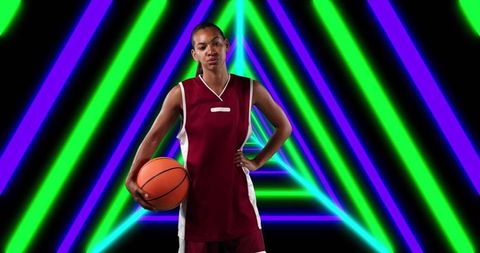 Confident Female Basketball Player with Ball on Neon Geometric Background