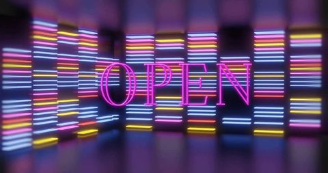 Vibrant neon open sign surrounded by multicolor led bars creating futuristic ambience