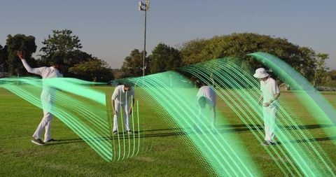 Fast bowler following through with neon motion trails, teammates inspecting wicket