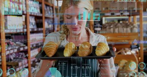 Bakery owner presenting fresh croissants with financial data overlay, retail analytics