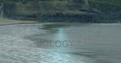 Solitary figure on overcast coastal cliff shore reflecting faint reversed tech overlay