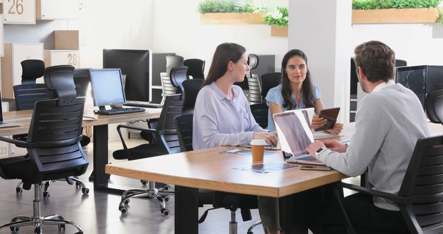 Team Meeting in Modern Office with Laptops and Tablets - Download Free Stock Images Pikwizard.com