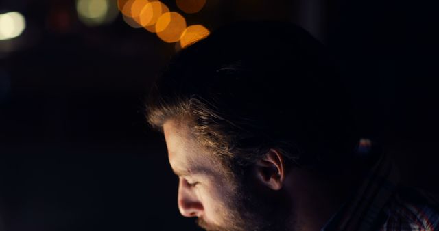 Man with Beard Working on Computer at Night with Bokeh Lights - Download Free Stock Images Pikwizard.com