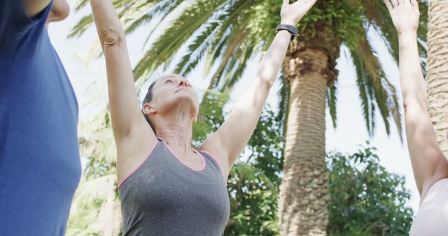 Senior Woman Doing Yoga Outdoors Under Palm Trees - Download Free Stock Photos Pikwizard.com