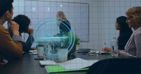 Female leader presenting strategy on whiteboard to diverse team with holographic data overlay