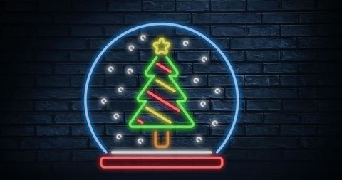 Neon Christmas Tree in Snow Globe on Brick Wall