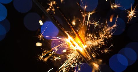 Festive Sparklers with Blue Bokeh Lights for Celebrations - Download Free Stock Images Pikwizard.com