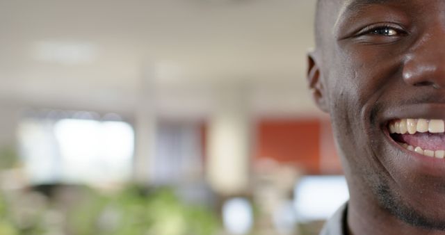 Close-Up of African American Man Smiling in Office Environment - Download Free Stock Images Pikwizard.com