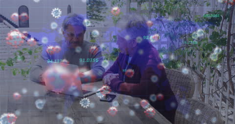 Seniors Analyzing Data with Virus Overlay on Laptop