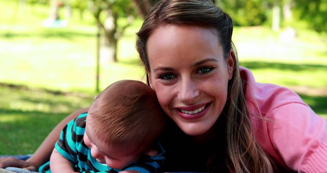 Smiling Mother with Baby Enjoying Outdoor Picnic - Download Free Stock Images Pikwizard.com