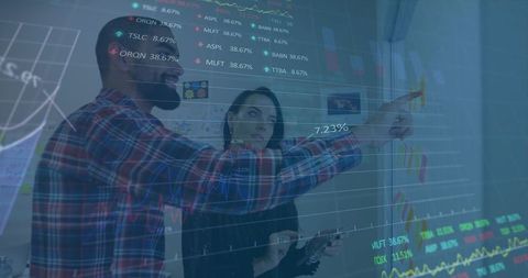 Business Professionals Analyzing Data with Transparent Screen Interface