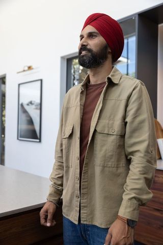 Confident Indian Man in Red Turban in Minimalistic Interior