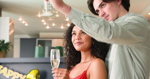 Happy Couple Celebrating Anniversary with Champagne