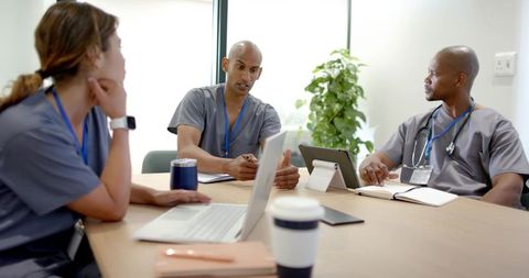 African american clinicians leading collaborative patient care meeting in modern clinic