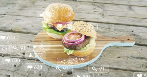 Burgers on Wooden Board with Social Media Icons Overlay
