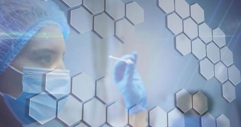 Healthcare worker wearing mask and gloves holding swab with hexagonal technology overlay