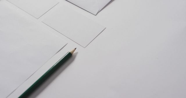 Image of envelope and white cards with copy space on white background. communication and tradition concept.