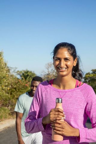 Diverse Friends Sharing Outdoor Jogging Experience on Bright Day
