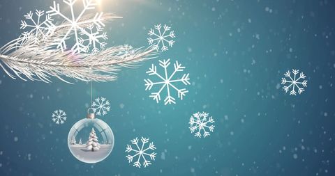 Christmas Ornaments and Falling Snowflakes on Blue Background