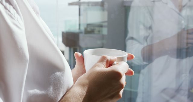 Person Holding White Mug in Modern Setting - Download Free Stock Images Pikwizard.com