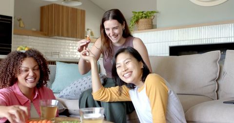 Joyful Female Friends Enjoying Healthy Snacks at Home