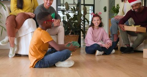 Diverse Family Joyful Gift Exchange during a Festive Celebration