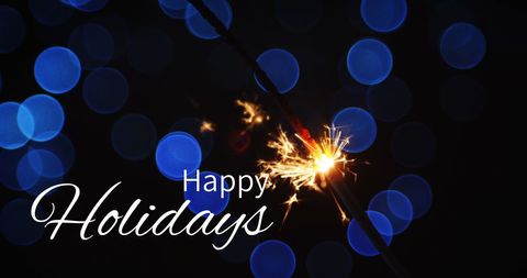 Festive Sparkler with Message Against Blue Light Bokeh - Download Free Stock Images Pikwizard.com