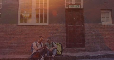 Biracial Male Friends Communicating at School Doorway