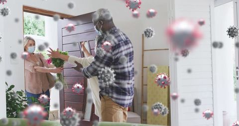 Couples Socializing at Home During Covid-19 with Floating Virus Cells