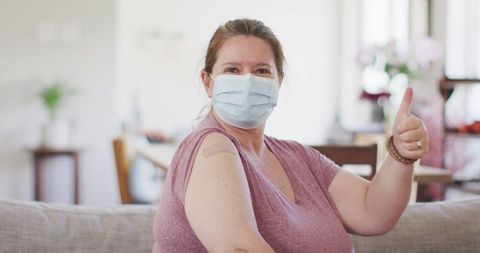 Woman After Vaccination Thumbs Up Wearing Protective Face Mask
