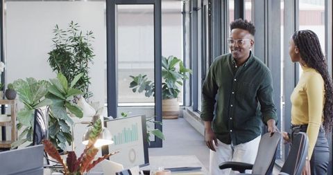 Colleagues collaborating in contemporary office