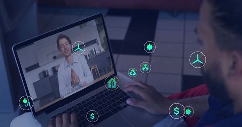 Businessman engaging in virtual meeting with digital icons overlay