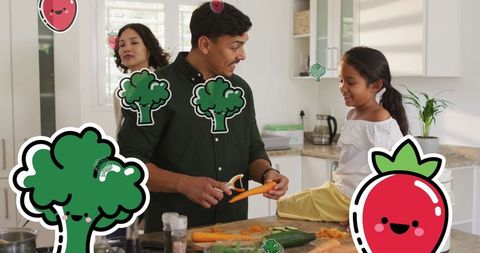 Happy family preparing a meal in modern kitchen with playful food icons