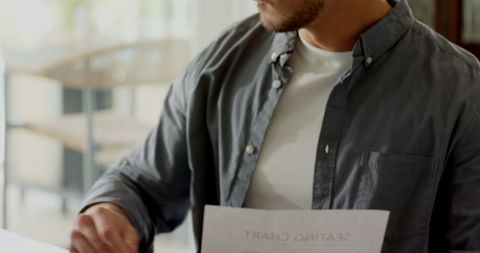 Man engaged in creative writing at home office